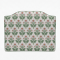 Floral patterned headboard on a white background