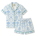 Floral pajama set with blue and green details on a white background